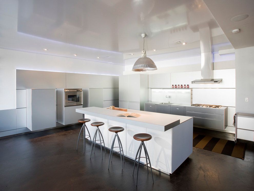Contemporary Futuristic Kitchen with Laminate Countertops and Paneled Appliances