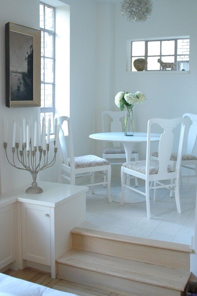Simple Romantic Dining Room with a Vase of Flowers and Candles