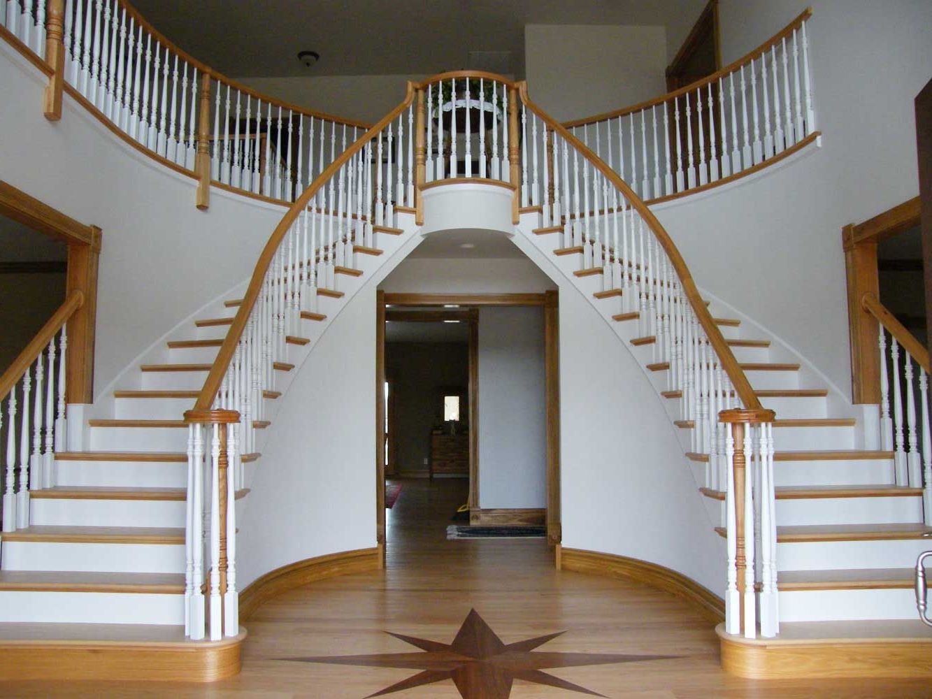 Awesome Double White Curved Staircases Designed Over Doorway For Modern Hallway Decor (Photo 749 of 7825)
