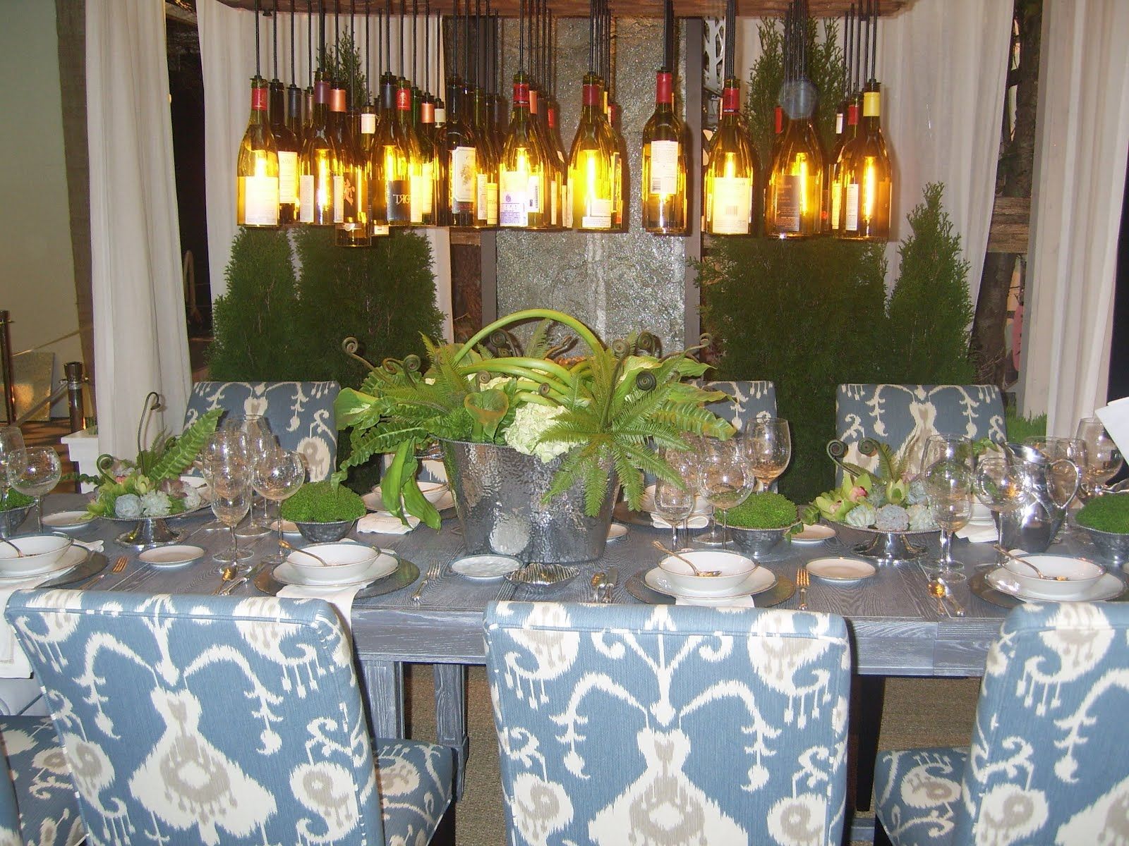 Natural Succulent Plants Centerpiece Under Wine Bottle Chandelier Plus Blue Floral Upholstered Chairs Decor (Photo 2425 of 7825)