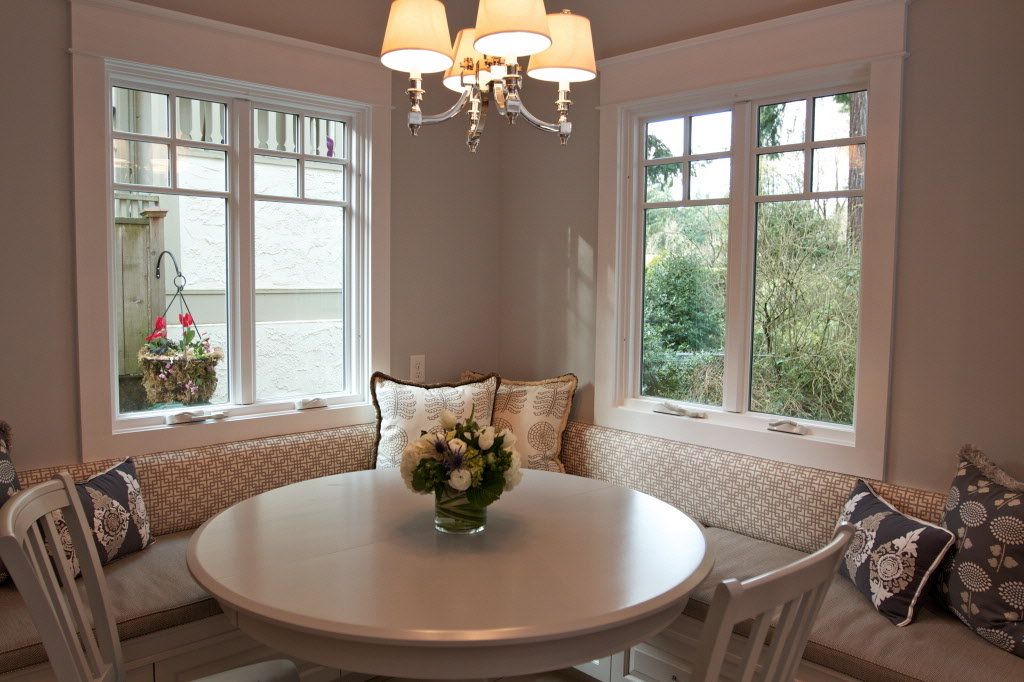 Neutral Cream Dining Room With Round Table Also Decorative Banquette Seating Near Awning Windows (Photo 2435 of 7825)