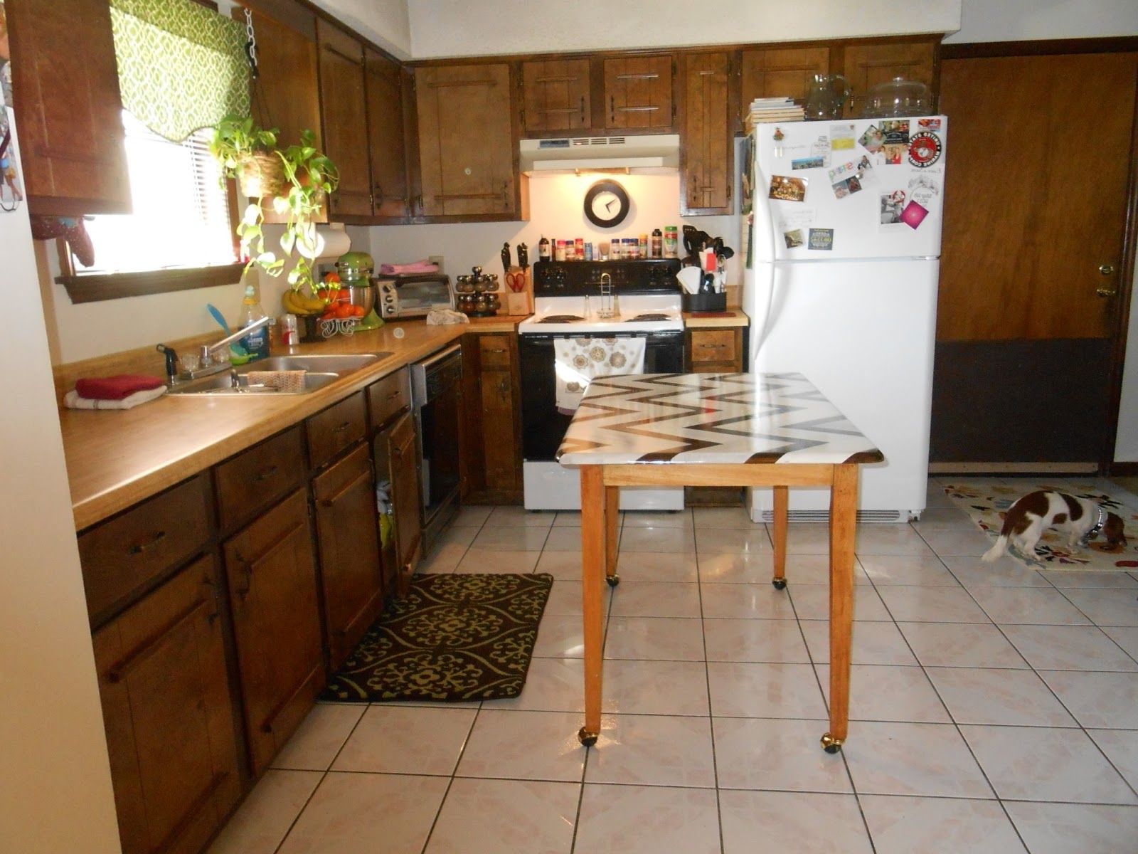 Unique Movable Kitchen Table With Chevron Top Idea Feat Cool Patterned Area Rug And White Refrigerator (Photo 3097 of 7825)