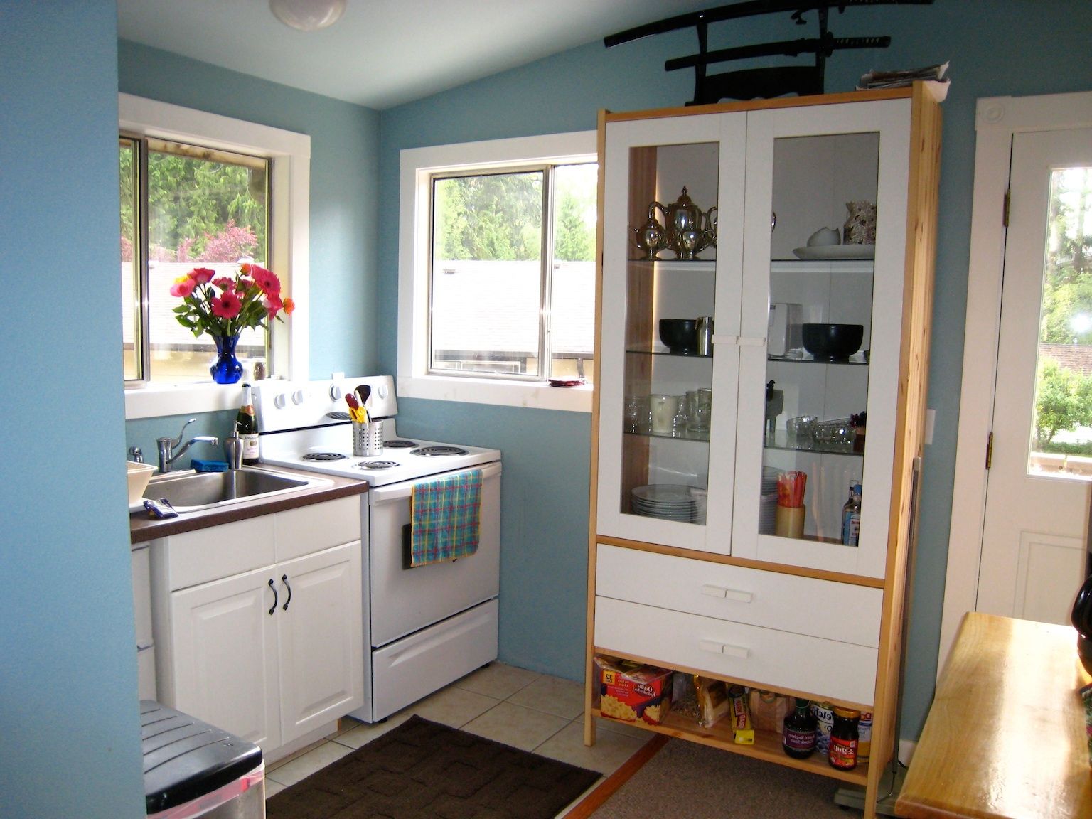 Vintage Glass Pantry Cabinet In Nice Kitchen Remodel And Design With Light Blue Wall Color (Photo 3146 of 7825)