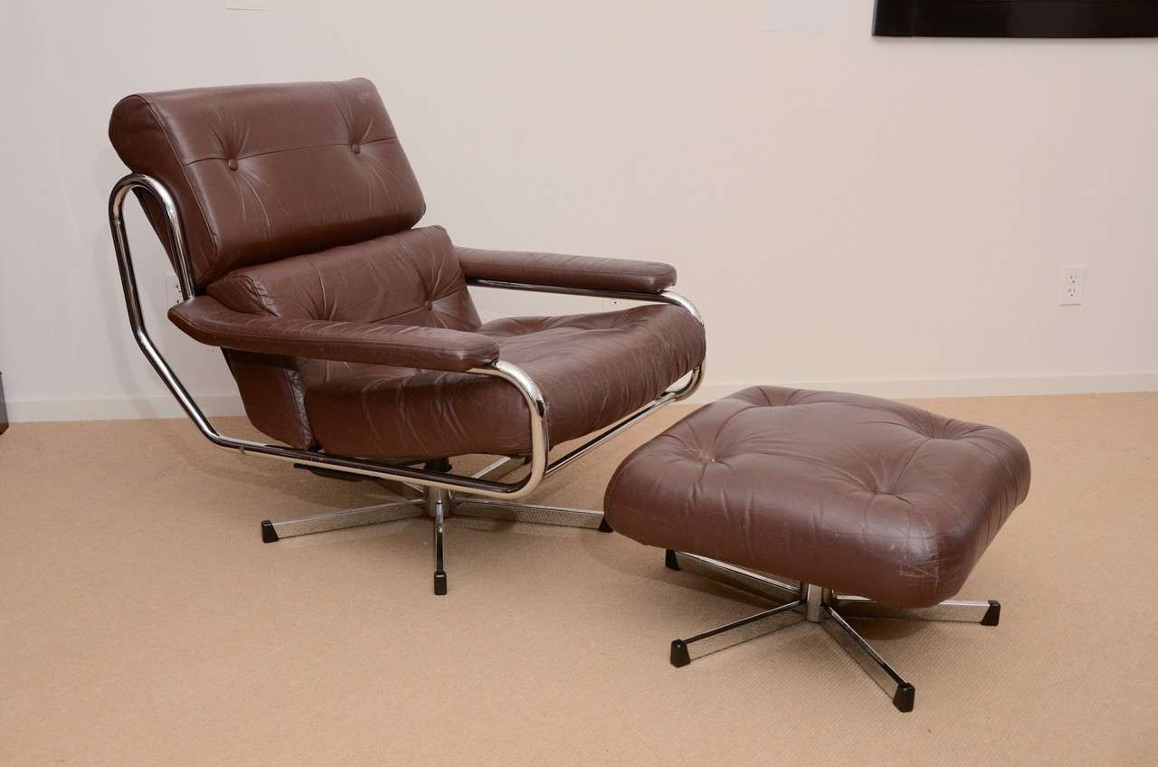Amala Dark Grey Leather Reclining Swivel Chair Ottoman Living Spaces Inside Amala White Leather Reclining Swivel Chairs (View 5 of 25)