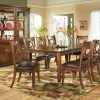 two-tone-brown-lined-area-rug-set-under-oak-kitchen-table-with-unique-chairs-set-in-front-of-floor-lamp (Photo 3055 of 7825)